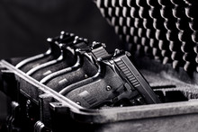 Black Handgun In Plastic Secure Storage Case
