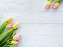 Lovely Tulip Flowers On White Wooden Background, Holiday Postcard For Women's Day Or Mother's Day. Floral Spring Background With Copy Space. Flat Lay.