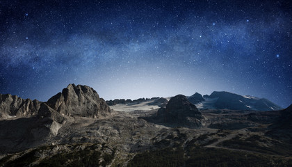 Canvas Print - starry night sky in a mountain landscape