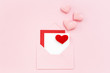 Valentine card in envelope with pink hearts