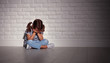 © JenkoAtaman - upset sad sad child girl in stress cries at an empty dark wall