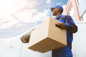 Wall Mural - Loader Man With Cardboard Box