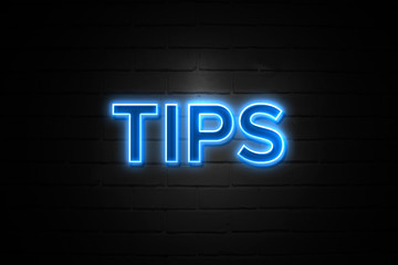 Tips neon Sign on brickwall