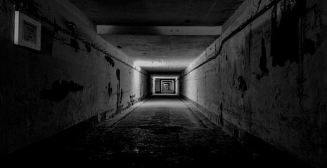 dark underground tunnel with lights creating depth