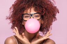 Afro Girl Blowing Bubble Gum Balloon.