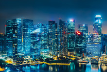 Singapore City Skyline. Business District Aerial View. Downtown Landscape Reflected In Water At Night In Marina Bay. Travel Cityscape