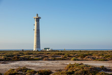 Lighthouse On Morro Jable Beach On Jandia Peninsula In Sunrise Light, Fuerteventura, Canary Islands, Spain