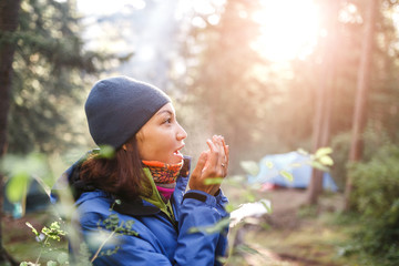 Wall Mural - Active woman in cold weather in mountain camping