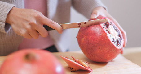 Wall Mural - Cutting red pomegranate