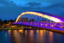 Bernatka Footbridge Over Vistula River In Krakow At Night. Poland. Europe.