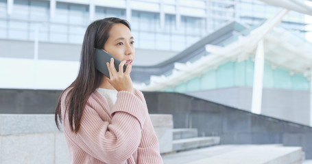 Sticker - Woman talk to mobile phone at outdoor