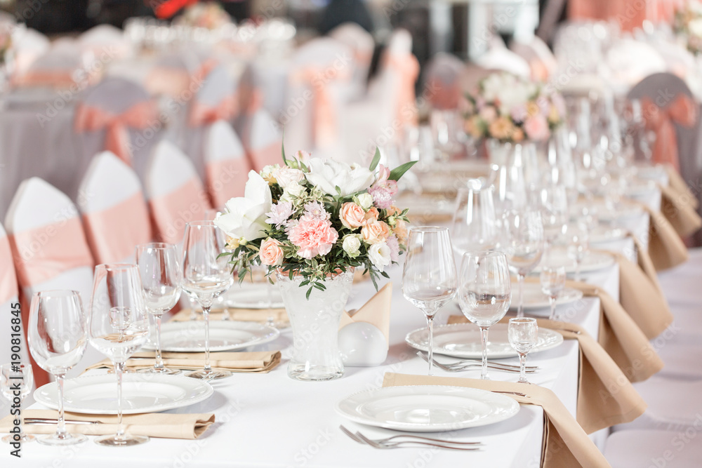 Tables set for an event party or wedding reception. luxury elegant table setting dinner in a restaurant. glasses and dishes. - obrazy, fototapety, plakaty 