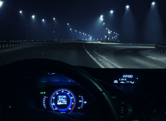 Wall Mural - view through the windshield of the car.winter highway at night