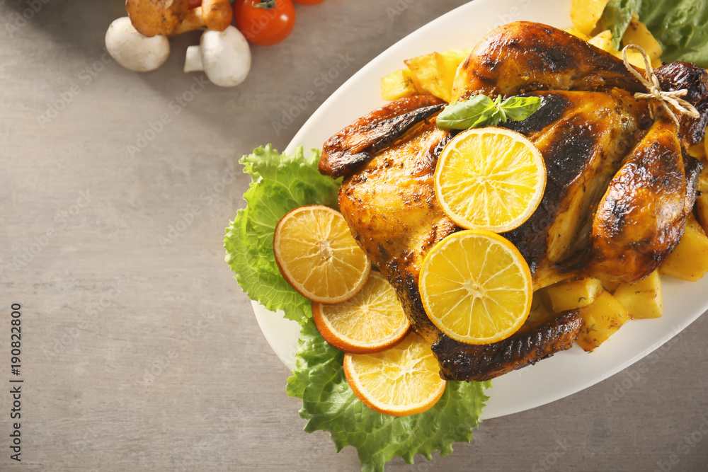 Delicious whole roasted chicken served on plate