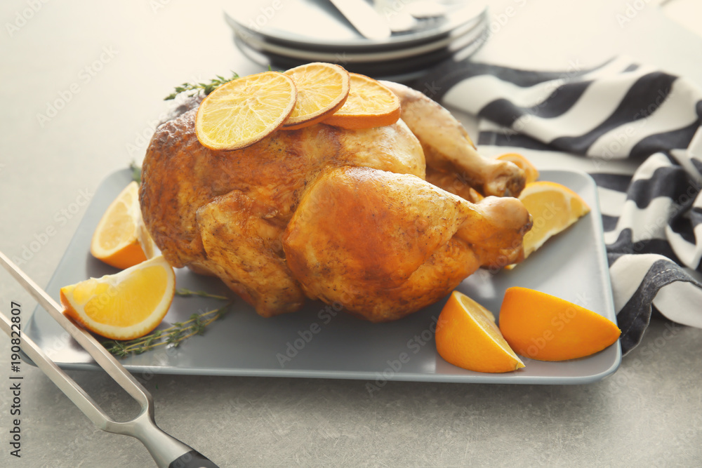 Delicious whole roasted chicken served on plate