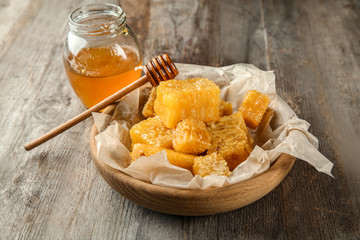 Wall Mural - Jar with sweet honey and combs on wooden table