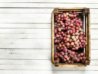 Wall Mural - Fresh red grapes in a box.