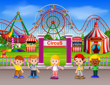 Childrens Having Fun In Amusement Park At Daytime