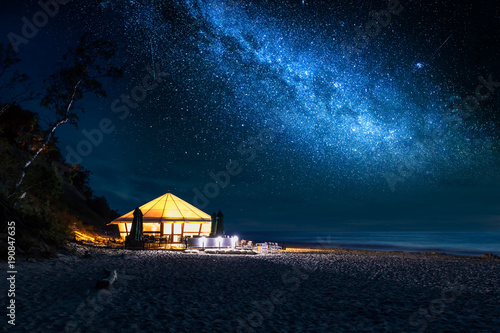 Beach with glowing tent at ...