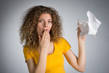 Woman tearing paper