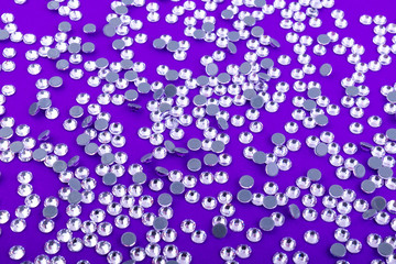 Canvas Print - Bright and Shiny Precious Rhinestone Swarovski crystal color on a purple background.