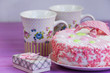 © mikitiger - biscuit cake on a pink wooden background