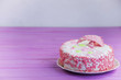 © mikitiger - biscuit cake on a pink wooden background