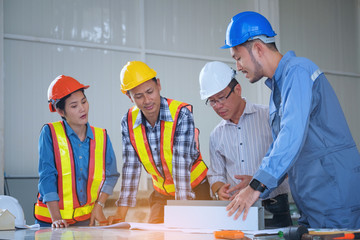 Wall Mural - Engineers are meeting, working and looking at Home blueprint in the office to discuss.Engineering tools and construction concept.