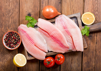 Poster - fresh fish fillet with ingredients for cooking
