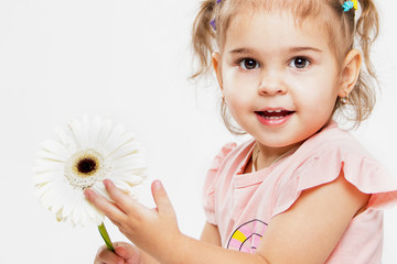 Portrait of a beautiful little cheerful girl on a white background