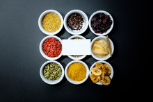 Spices And Herbs On A Black Background With A Place For The Text On The Business Card