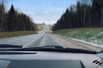 The view from the car on the road through the windshield