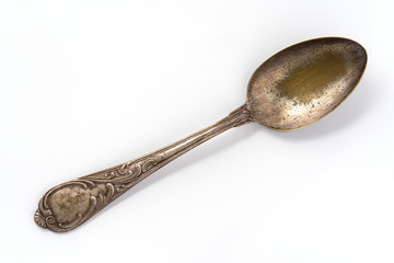 old spoon on white background