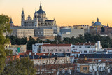 Fototapeta Paryż - Sunset view of Royal Palace and Almudena Cathedral in City of Madrid, Spain