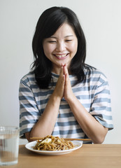 Canvas Print - Asian woman about to eat noodles