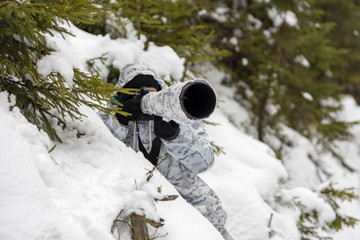 Wall Mural - Wildlife photographer outdoor in winter