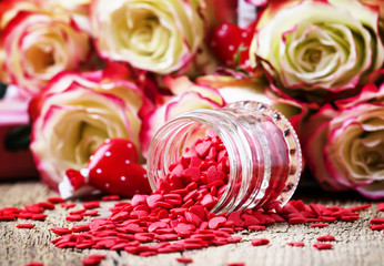 Wall Mural - Red sweet heart, Valentines Day card on background of fresh pink and white roses, selective focus