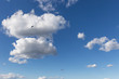 © Massimo - Some paragliders flying against a beautiful deep, blue sky, with big white clouds