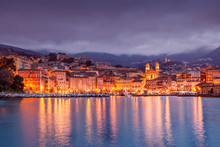 Bastia, A Beautiful City Landscape, A Port With Boats, A Sunset And The Lights Of A Night City. France, Corsica, A Popular Destination For Travel In Europe