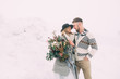 © nazariykarkhut - Photo of happy man and woman outdoor in winter