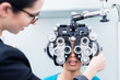 © Kzenon - Optometrist and woman at eye examination with phoropter