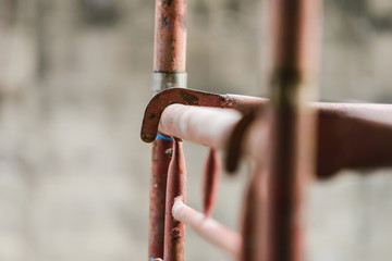 Wall Mural - scaffolding in construction. scaffold pipe clamp and parts, construction site.