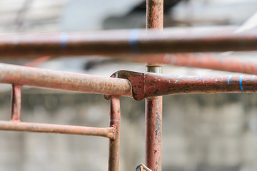 Wall Mural - scaffolding in construction. scaffold pipe clamp and parts, construction site.