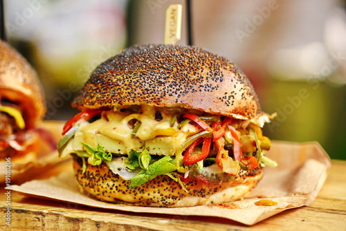 vegan burger in the street market © Iliya Mitskavets
