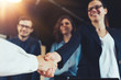 © Alex from the Rock - Business people shaking hands in the office. Finished successful partnership, meeting room conference.