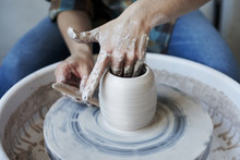 Close-up Of Hands Doing A Pot Or A Vase In Ceramic Studio, Craft Working Process With Clay Potter's Wheel
