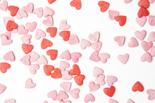 Close-up View Of Red And Pink Sugar Hearts Forming An Abstract Background Pattern.