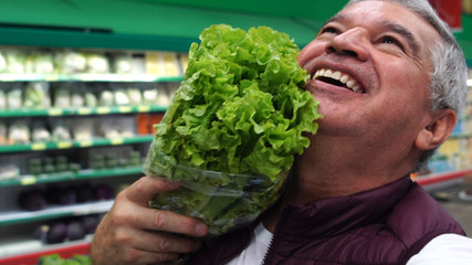 Wall Mural - Senior Man Taking a Selfie with Lettuce