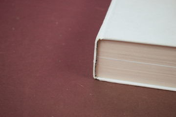 White blank hardcover book on red background