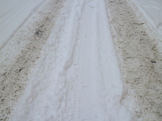 car footprints in the snow